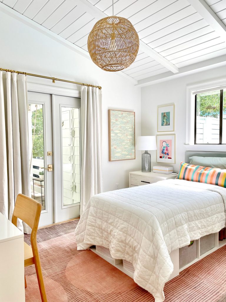 Girls Bedroom With Lofted Plank Ceiling And Pink Rug