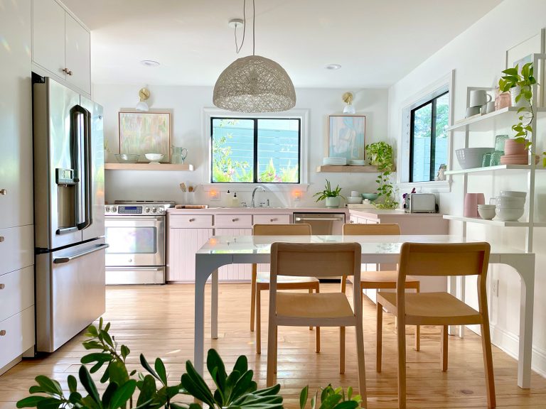 Closer View Of Beachy Kitchen From Sitting Area With Dining Table And Built In Pantry