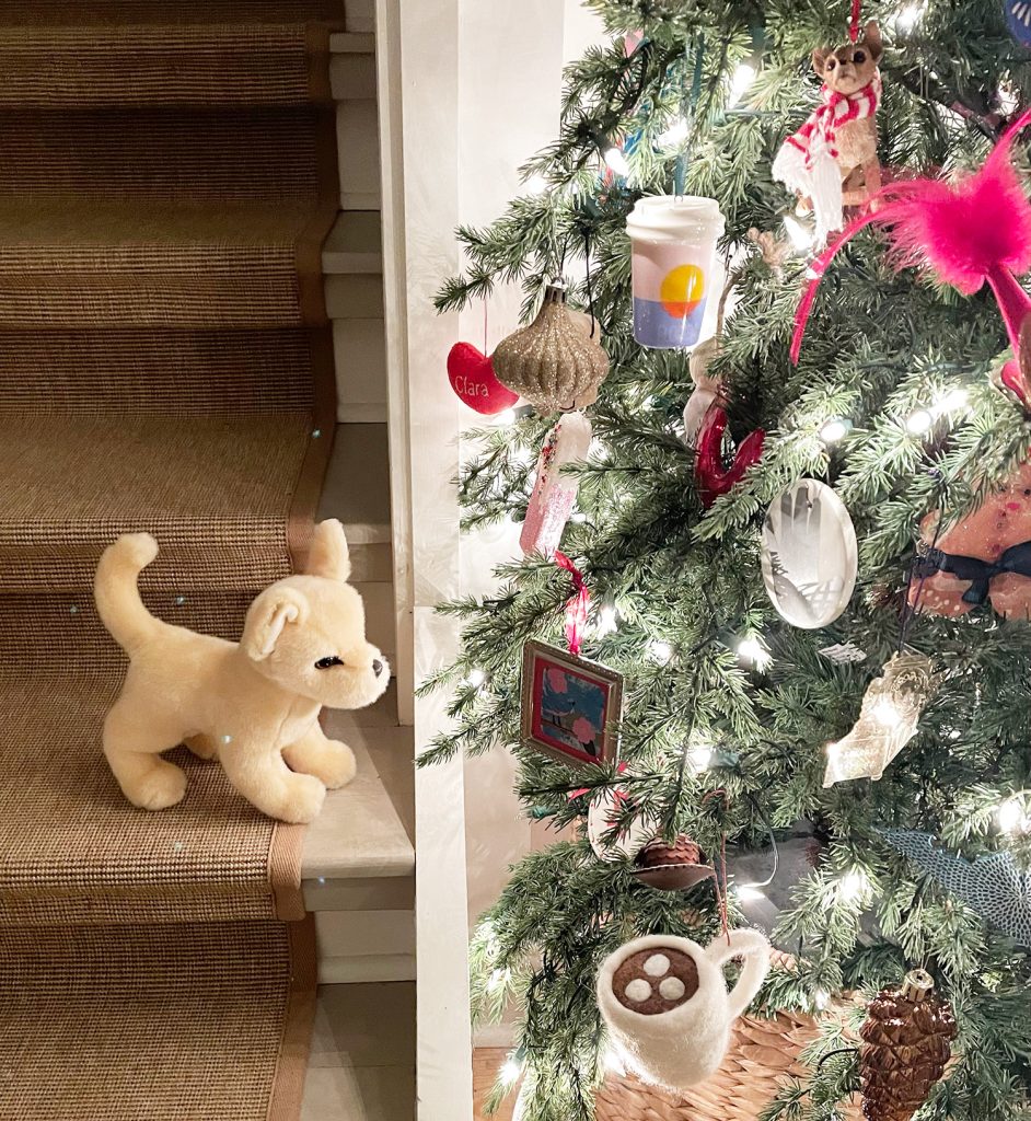 Chihuahua stuffed animal viewing Christmas Tree ornaments