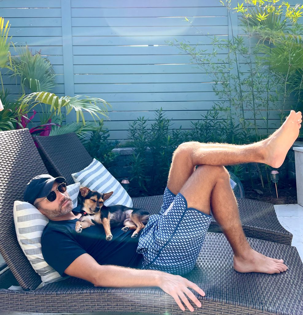 Penny and John sleeping together on pool patio lounger