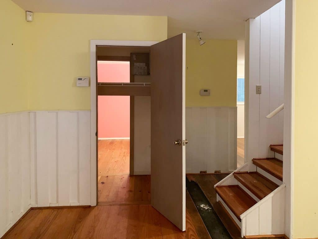 Before Photo of Laundry Closet With Single Door And Yellow Walls