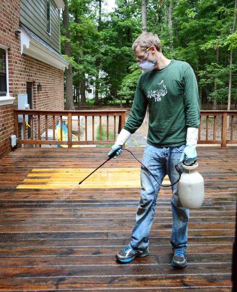 John using pump sprayer to apply deck cleaner brightener