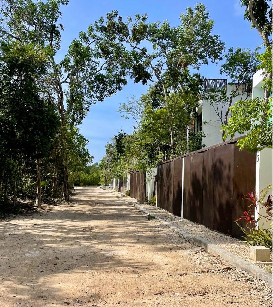 Unpaved Street With Gated Homes In La Veleta Tulum Mexico