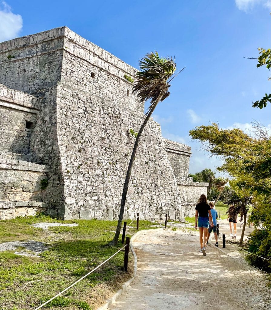 Kids Walking In Front of Castillo At Tulum Ruins Mexico