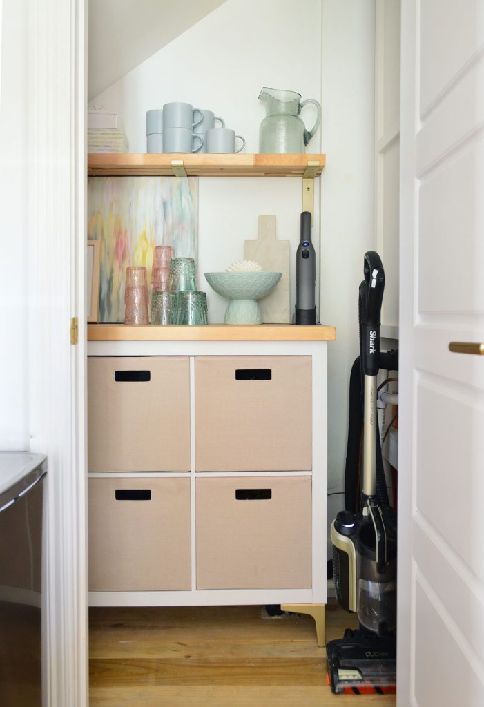 After Photo Of Utility Closet With Pretty Cubby Storage And Butcher Counter