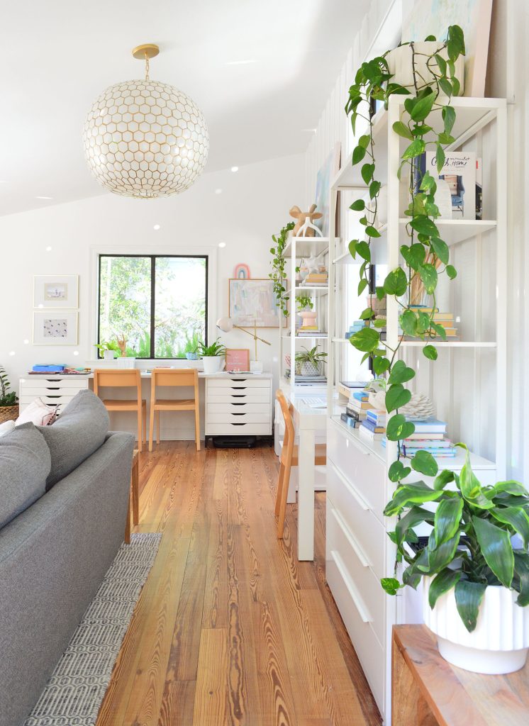 Upstairs family room with plants and Serena & Lily capiz pendant light