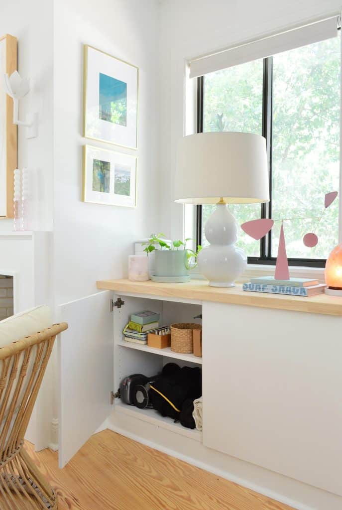 Ikea Besta storage unit door open to display camera equipment