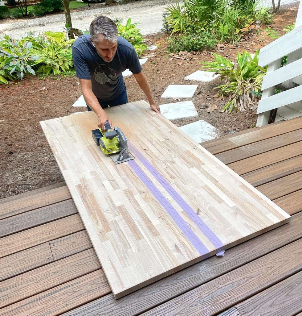 John Cutting Butcher Block Island Counter Top In Half With Circular Saw