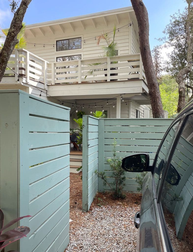Open Fence Gate Showing Car Parking Access To Kitchen Porch