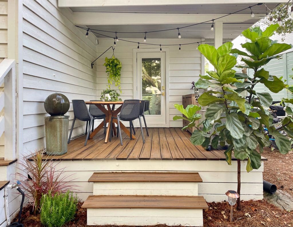 Full View of Kitchen Porch With Outdoor Table Fountain And Fiddle Leaf Fig