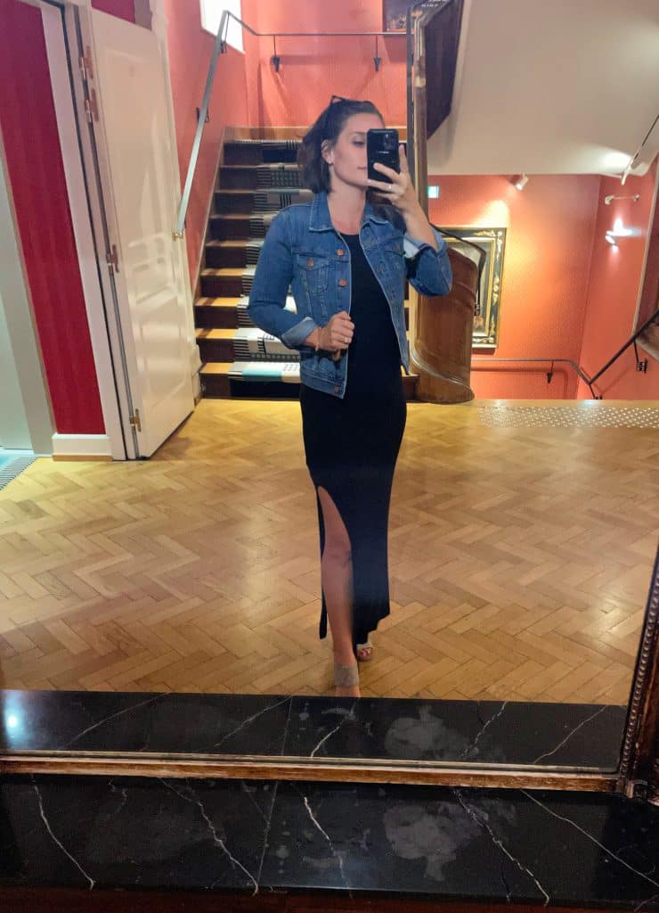 Sherry selfie in hotel mirror with long black dress and sandals