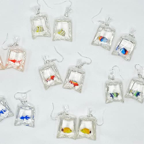 Collection of Earrings That look Like Fish In Plastic Bags
