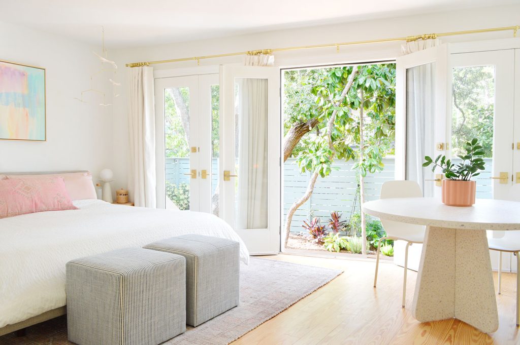 Bedroom With King Bed And Open French Doors To Garden