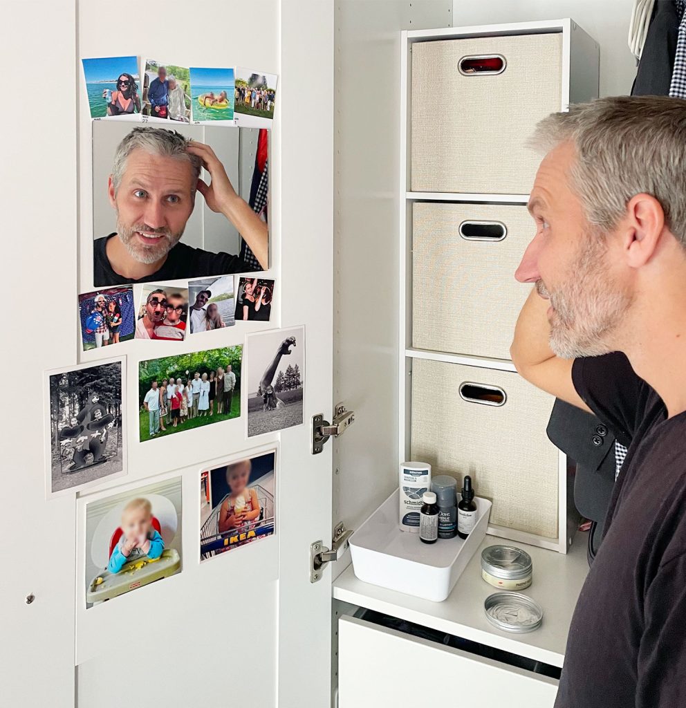 John getting ready in closet mirror in Ikea Pax Wardrobe