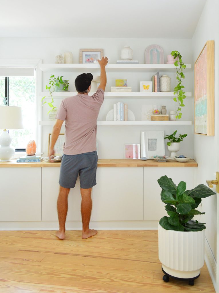 John Reaching To Top Shelf Of Three Ikea Lack Floating Shelves