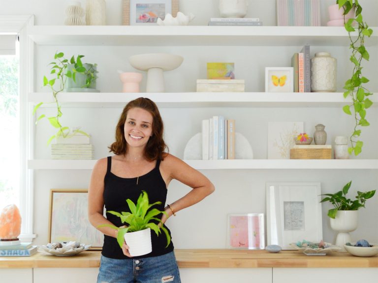 Sherry Standing In Front Of New Ikea Floating Lack Shelves