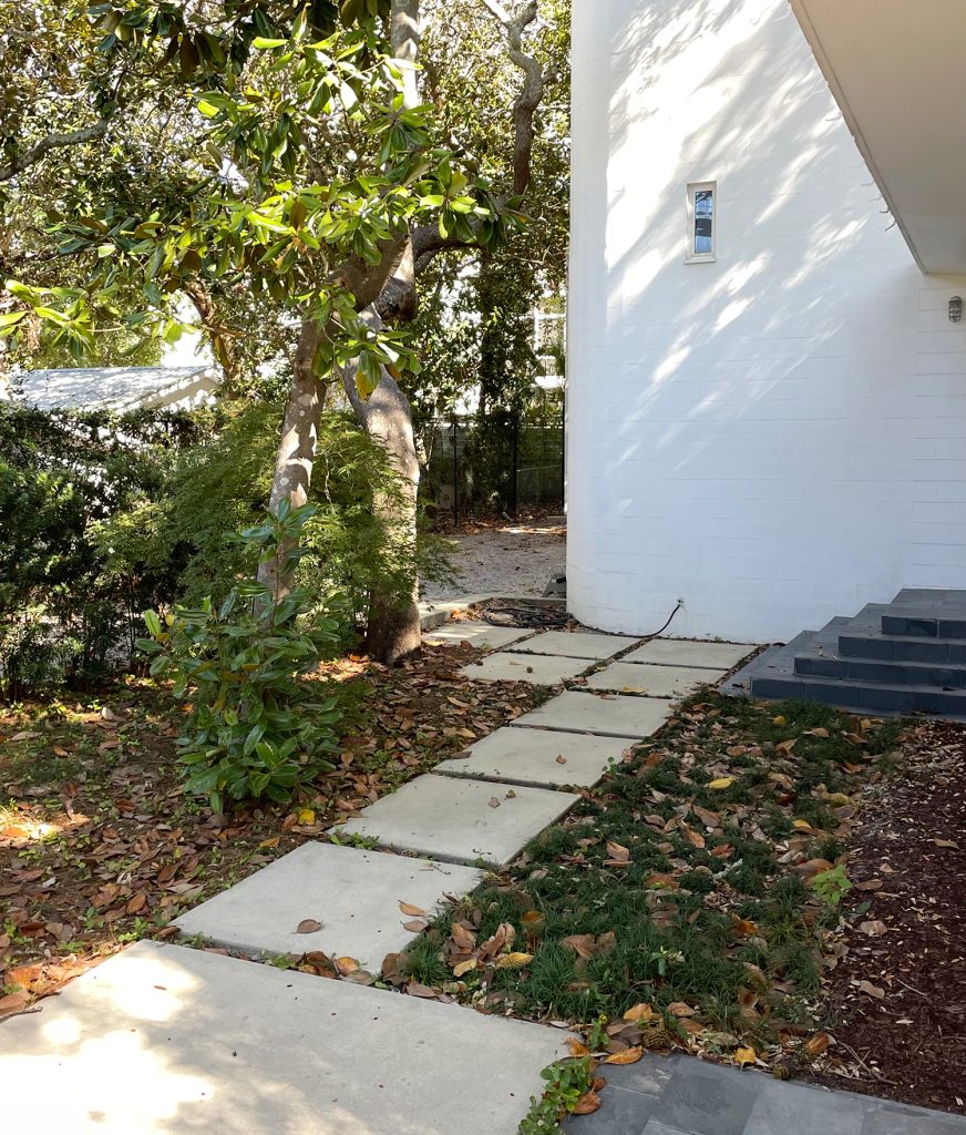 Neighbor House With Large Concrete Pavers