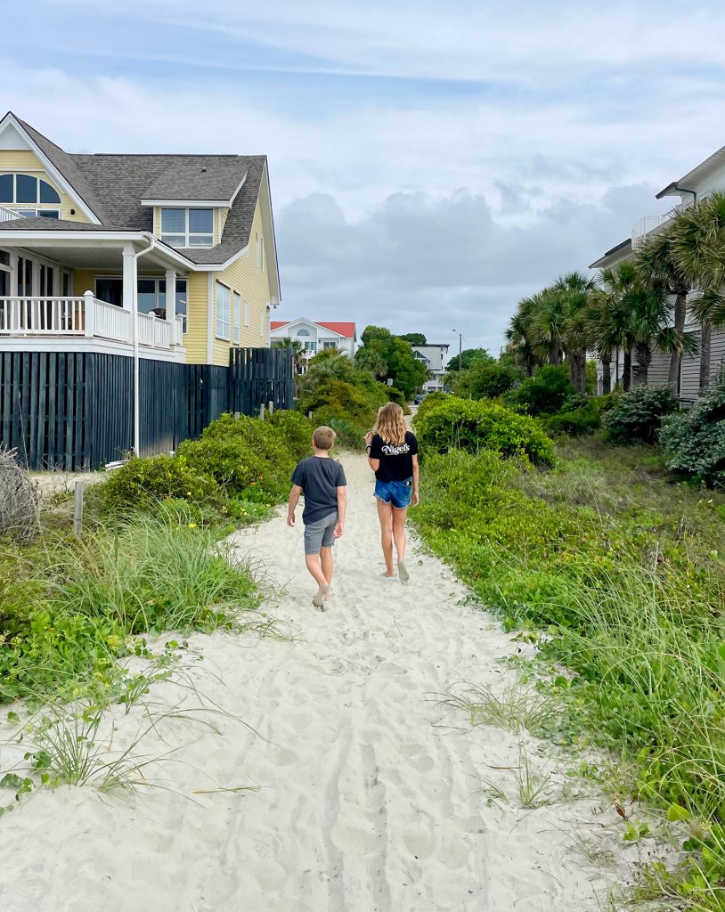 Children Walking Down Beach Access At Isle Of Palms South Carolina