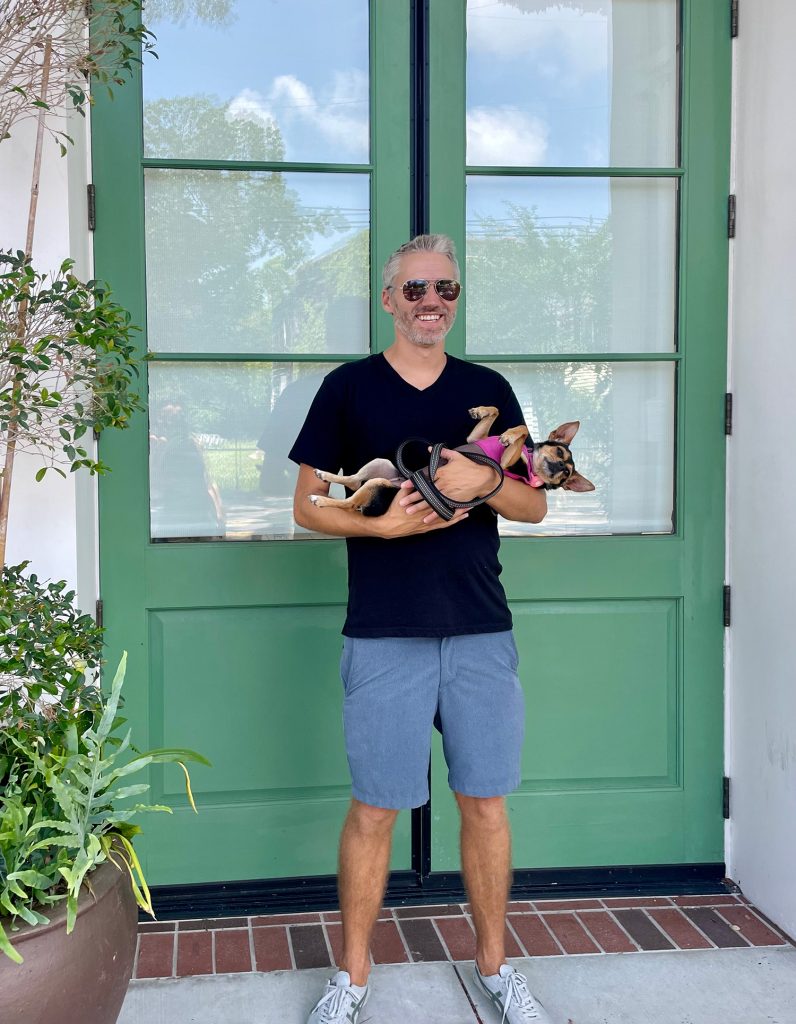 John Holding Penny The Chorkie In Charleston South Carolina