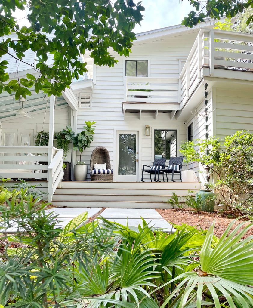 Exterior Of White Modern Home With Siding And Florida Landscaping