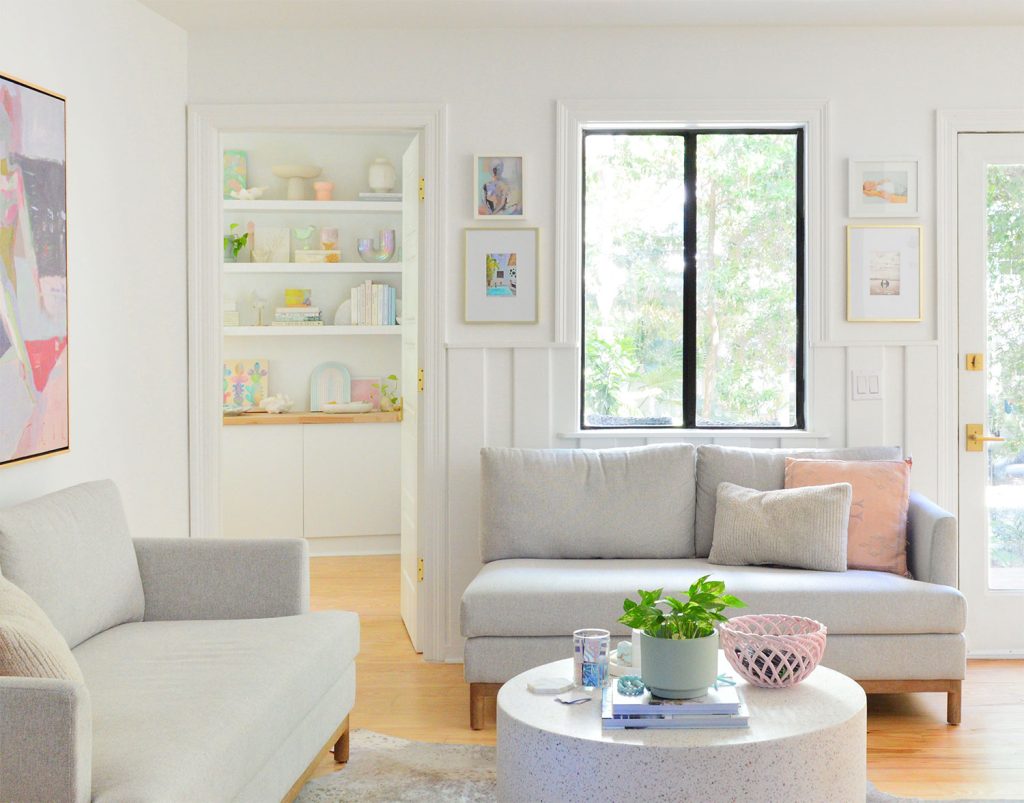 Sitting Area With Loveseats And Doorway Intro Bedroom With Colorful Shelves