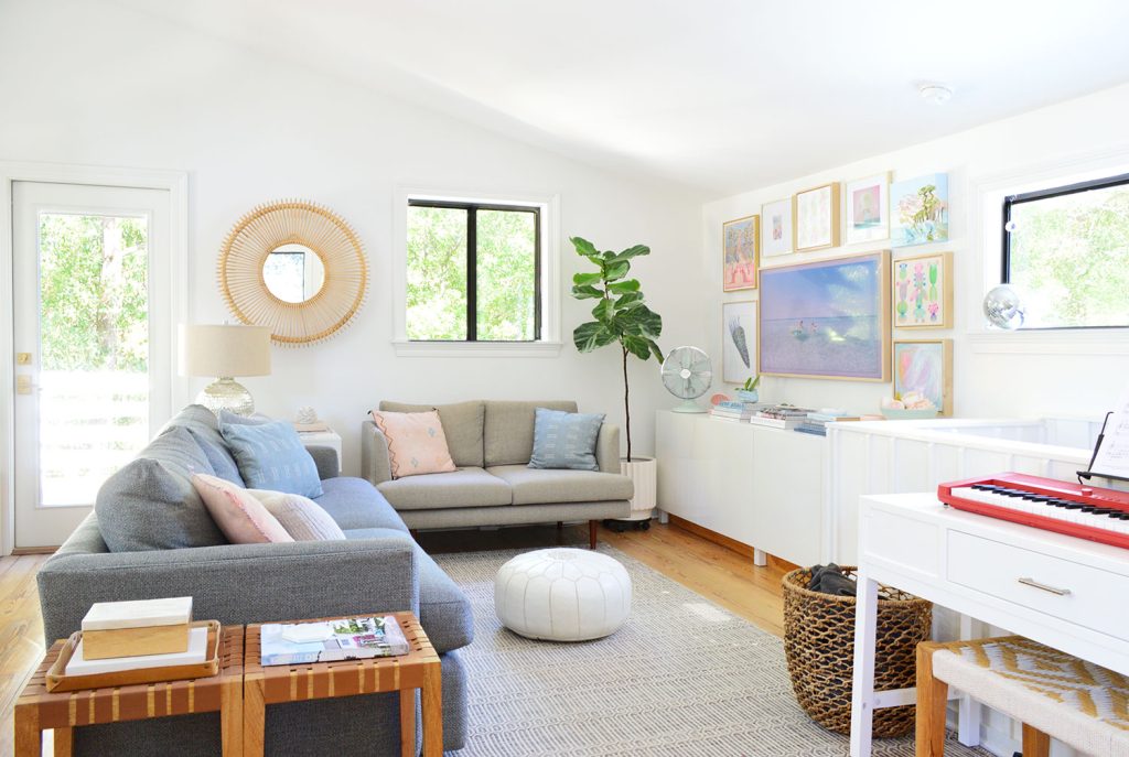 Bright Family Room With Frame TV Collage Hung On Wall