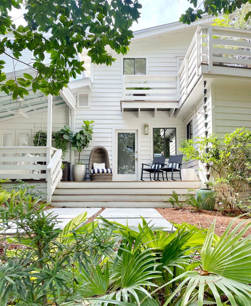 Exterior Of White Modern Home With Siding And Florida Landscaping