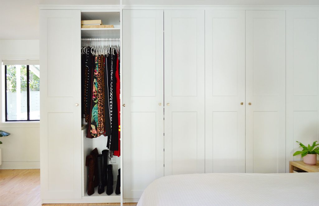 Wall Of Ikea Pax Wardrobe Closets With One Open Door