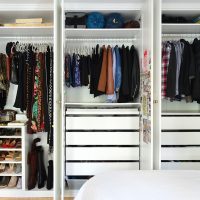 Wall of Open Ikea Pax Wardrobe Closets With Men And Womens Closets