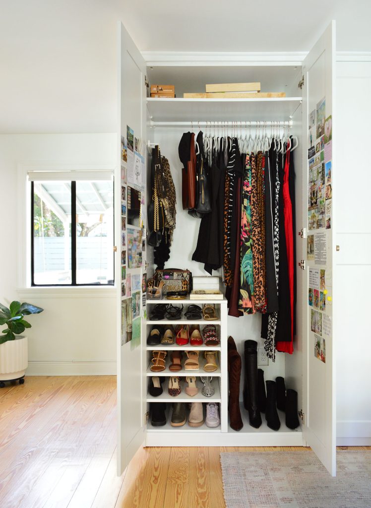 Open Ikea Pax Closet Wardrobe With Long Hanging Clothes And Shoe Storage