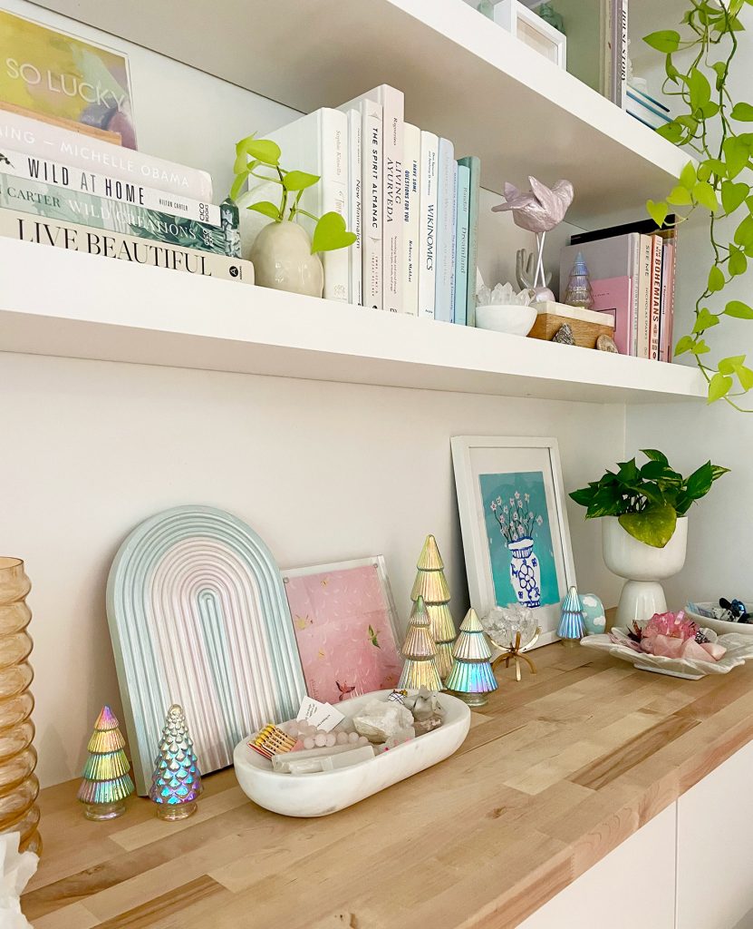 Decorated Floating Shelves With Small Decorative Iridescent Christmas Trees