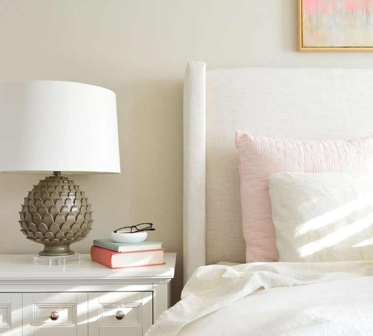 Edgecomb Gray Bedroom With Upholstered Headboard And Dark Lamp