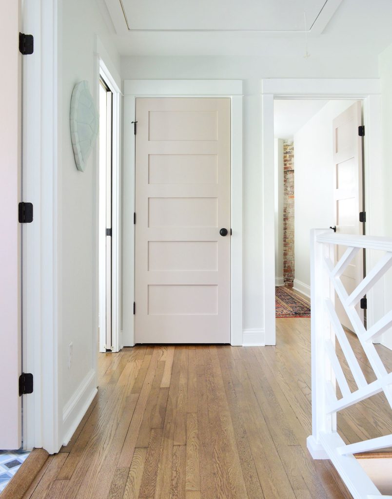 Hallway Upstairs Landing With Pink Doors And Extra White Trim