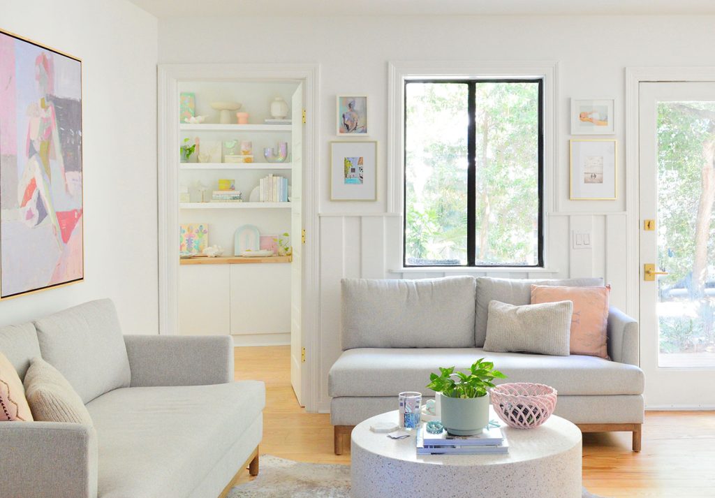 Close Up View Of Sitting Area With Gray Loveseats And Pure White Walls