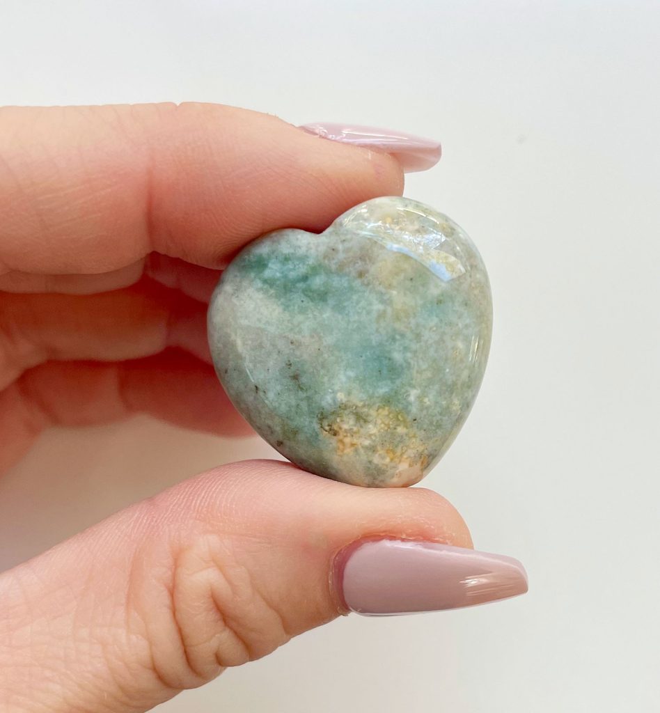 Ocean Jasper Crystal Heart Between Fingertips