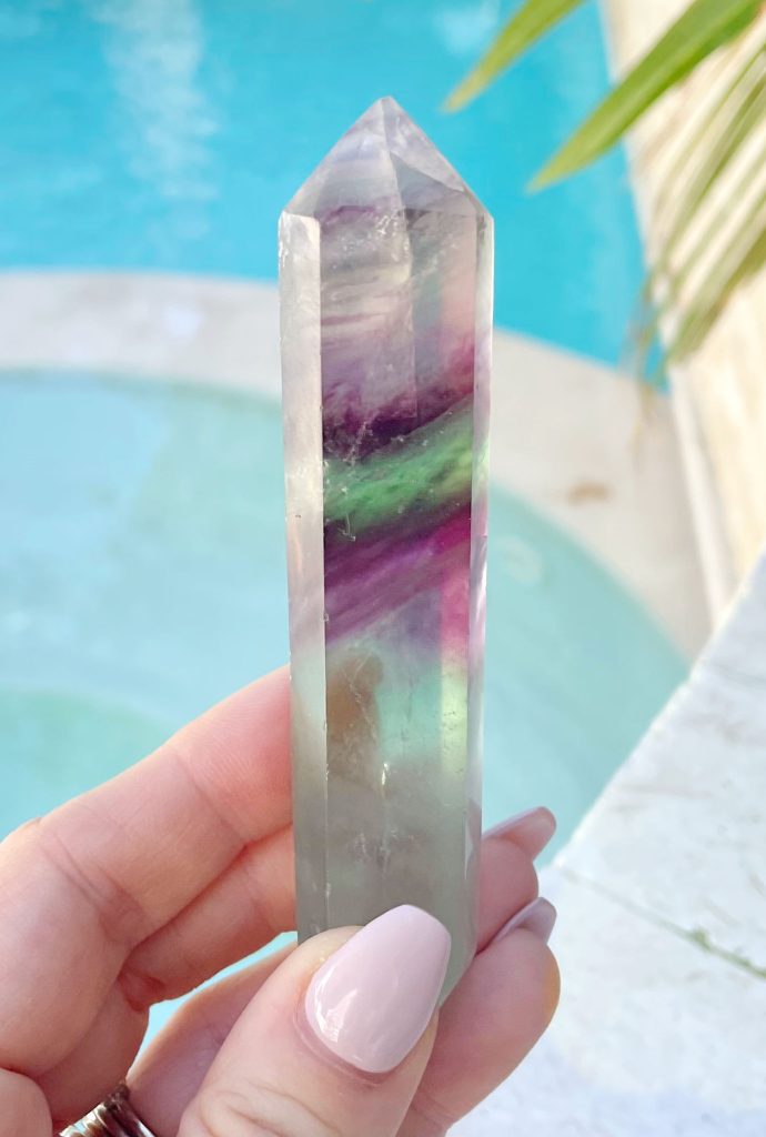 Rainbow Fluorite Crystal Point In Hand By Pool