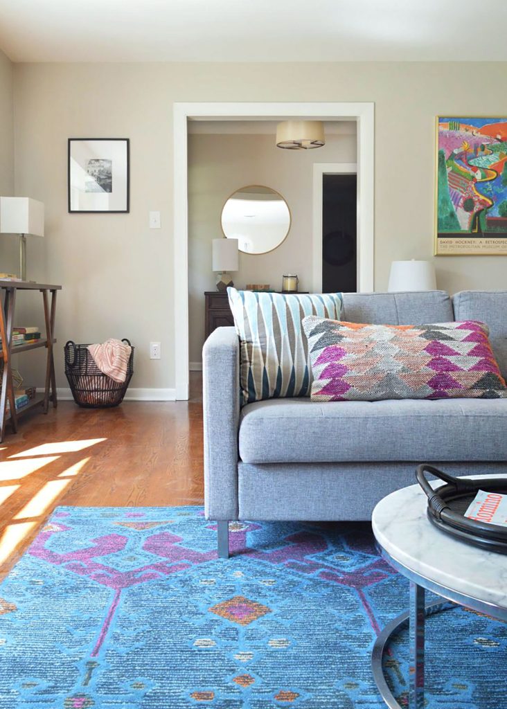 Living Room With Blue Rug and Sherwin Williams Agreeable Gray Walls
