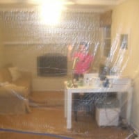 Using Plastic Tarps During Renovation To Keep Dust Out
