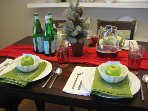 Holiday Table Setting With Pine Tree And Apples As Placecard Holders