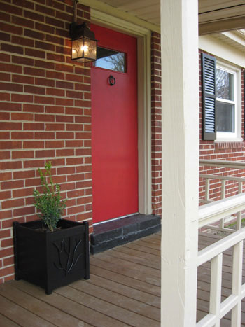 brick-house-red-door-black-shutters