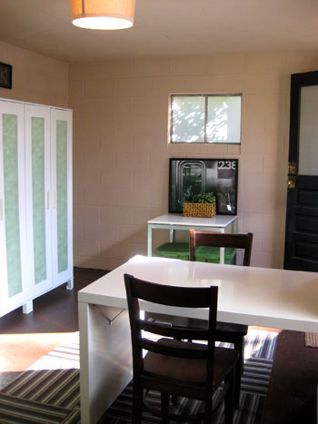 Painted Basement With Wardrobe Storage And Desk