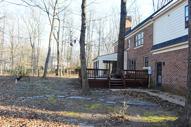 Before Photo Of Backyard With No Grass and Large Deck