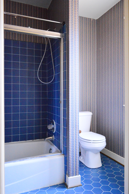 Before Photo Of Bathroom With Blue Tile and Striped Wallpaper