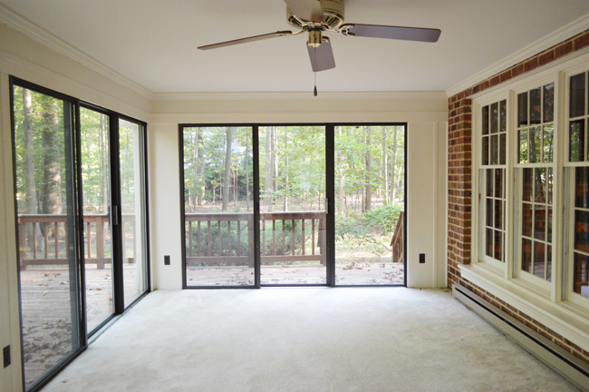 Before Photo Of Enclosed Porch With Carpet And Sliding Glass Doors