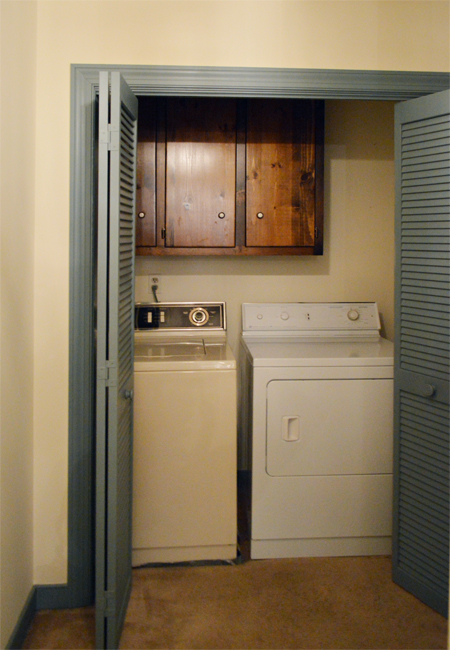 Before View Into Laundry Closet With Blue BiFold Doors