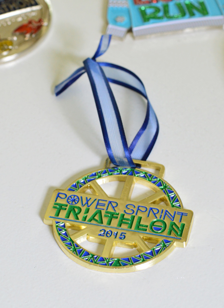 triathlon race medal with shorter ribbon to be hung on christmas tree