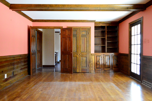 Before Photo Of Living Room With Dark Wood Build In Shelves And Wet Bar