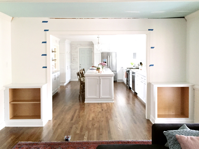 Painters Tape On Wall To Determine Spacing of DIY built-in bookshelves