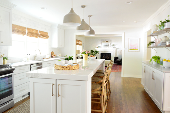 Fully renovated kitchen with new white cabinets and oversized kitchen island