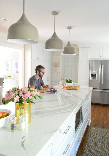 white-kitchen-remodel-john-working-at-island